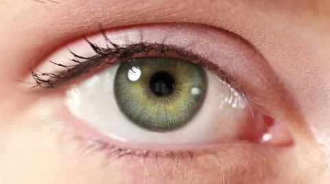 Zoom in from a green human eye to a neuron cell animation. Red. Stock Footage