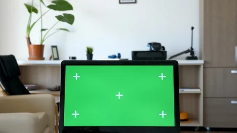Zoom in on green screen mock up laptop Stock Footage