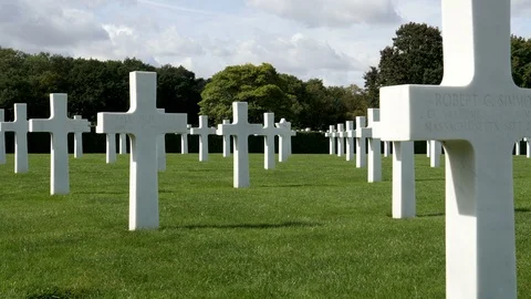 Zoom In-Ground level view rows of white crosses-American WWII Cemet Stock Footage 96753480