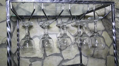 Zoom on hanging empty wine glasses Stock Footage 36524758