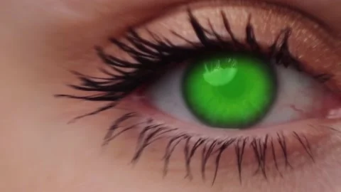 Zoom in on the human eye on the green ba... | Stock Video | Pond5