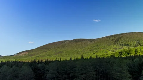 Zoom in hyperlapse tower timelapse of shadows and clouds moving on Radhost Hill Stock Footage 131128832