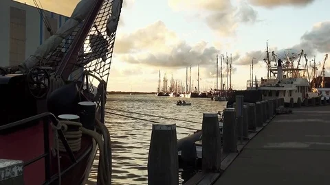 Zoom Inn to the charterships in the sunset Stock Footage 85023708
