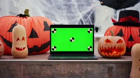 Zoom in laptop with a green screen with dots for tracking movement against the Stock Footage 219756579