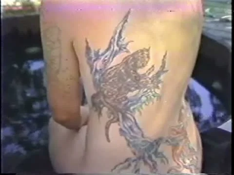 Zoom in on Large Back Tattoo Stock Footage 10849318