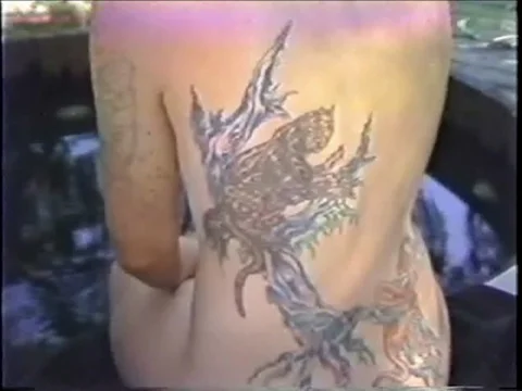 Zoom in on Large Back Tattoo Stock Footage 69528467