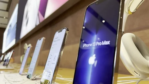 Zoom from the latest Apple Computers iPhone 13 Pro and AirPods Max headphones Stock Footage 164452118