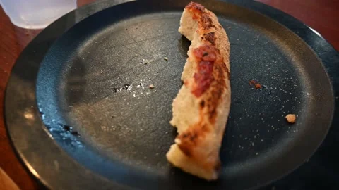 Zoom in on leftover pizza crust Stock Footage 135366313