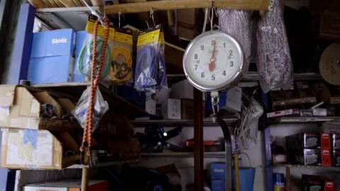 Zoom in on mechanical weighing scale inside hardware store Video stock 331271724