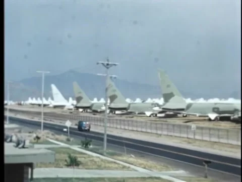 Zoom in to mini van moving on road near airport Stock Footage 260254723