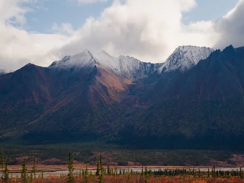 Zoom in to mountain cloudscape and light patches Stock Footage 80321762