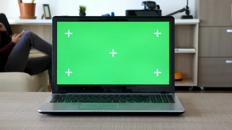 Zoom in on a notebook with isolated green screen and markers for tracking Stock Footage 95645265