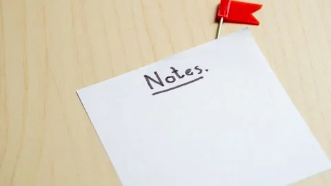 Zoom in notes a close look at organizing thoughts workspace desk focused Stock Footage 309850777