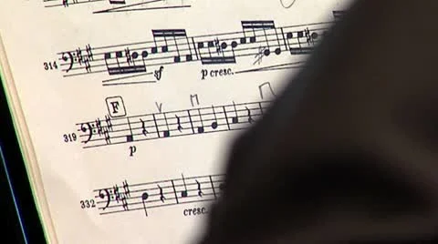 Zoom from notes to musician Stock Footage 10595005