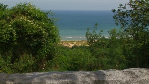 Zoom in to Omaha beach from cliff top Colleville sur Mer Normandy, France Stock Footage 103227950