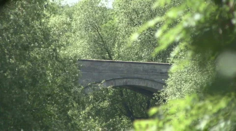 Zoom out and pan left from bridge at Piercebridge Stock Footage 458534
