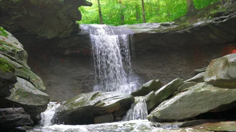 Zoom out from base of Blue Hen Falls in Cuyahoga Valley National Park Video stock 54561046