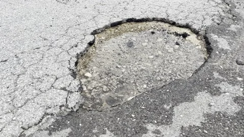 Zoom out Big pothole 스톡 동영상 238888585