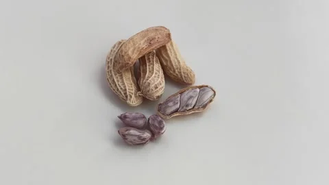 Zoom out. Boiled peanuts on a white background. Stock Footage 324610417