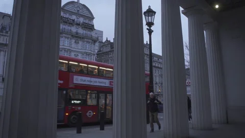 Zoom out from Bomber command memorial columns, red double-decker bus 動画素材 169998436