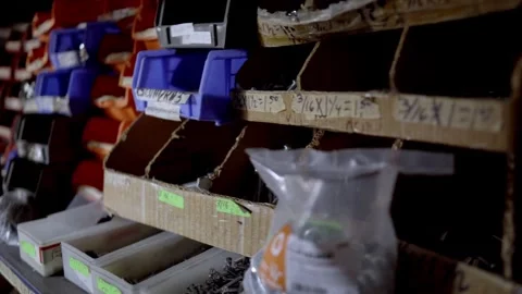Zoom out from boxes of nails in hardware store shelf Video stock 331162310
