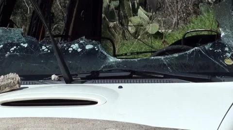 Zoom out broken front window of a blasted car Video stock 47410654