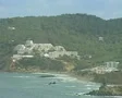 Zoom out from buildings on hillside to wide view of bay SD Footage