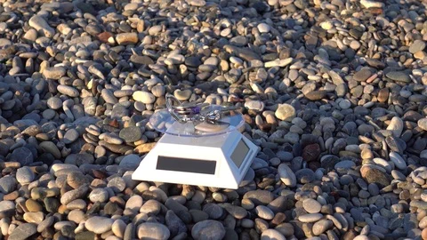 Zoom out a bunch of keys is turning on solar showcase on the beach Stock Footage 98296969