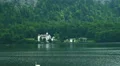 Zoom out castle at mountain forest lake Hallstatt Austria HD Footage