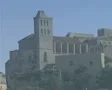 Zoom out from church on hill to town SD Footage