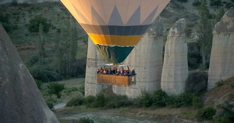 Zoom out from close up of Hot air balloons flying over "Love Valley", Goreme  Stock Footage 104187342