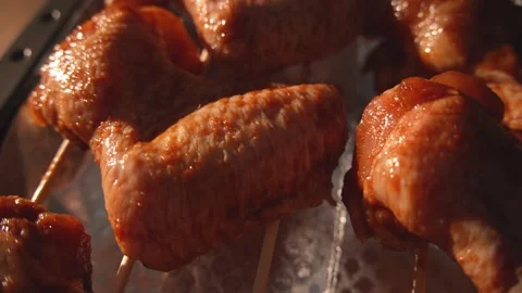 Zoom out from close-up of raw marinated chicken wings on foil Stock Footage 312647933