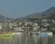 Zoom out from coastal town to gulet SD Footage