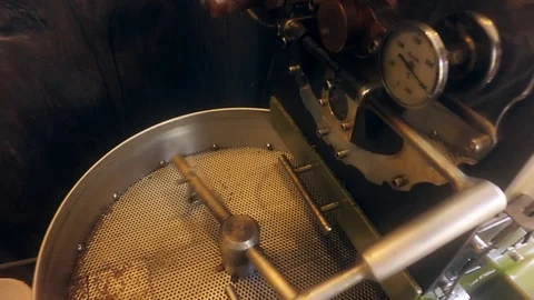 Zoom Out Of Coffee Beans Falling Into A Rotating Drum Stock Footage 88449512