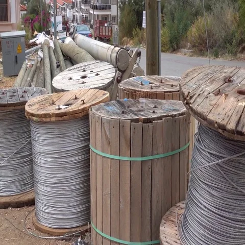 Zoom out coils of wire on electrification site Stock Footage 69408130