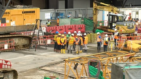 Zoom Out - Construction Workers having a Meeting on the Job Site Stock Footage 87206443