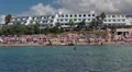 Zoom out of Coral Bay beach from the sea. People sunbathing, Paphos, Cyprus HD Footage
