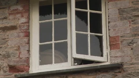 Zoom out from cottage windows Stock Footage 61575720