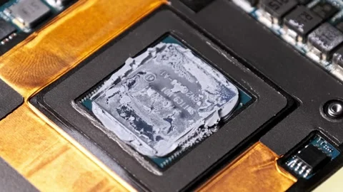 Zoom-Out from a CPU with Thermal Compound on a Circuit Board Stock Footage 314129570