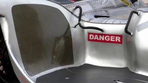 Zoom out: Danger sticker on a sidecar machine, Racing motorbike and sidecar Stock Footage 76769002