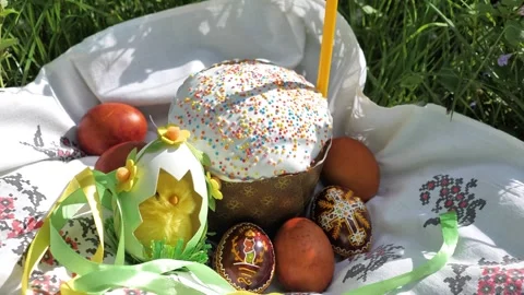 Zoom out of Decorated Easter cake with eggs and candle on ethno towel Stock Footage 274842939