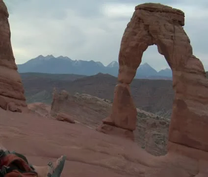 Zoom out from delicate arch to two ladies Stock Footage 21632919