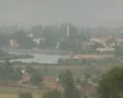 Zoom out from distance town to countryside view SD Footage