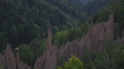 Zoom out from earth pyramids in the dolomites, Ritten, Italy Stock Footage 146170820
