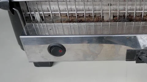 Zoom out electrical vertical toaster with glowing incandescent heating elements Stock Footage 342941945