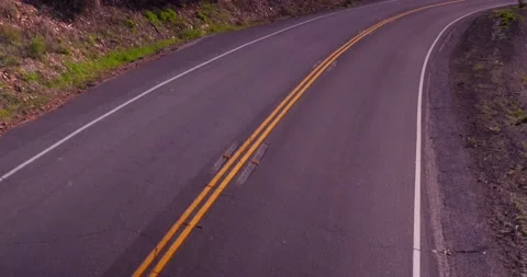 Zoom out of empty road from moving car Stock Footage 136341080