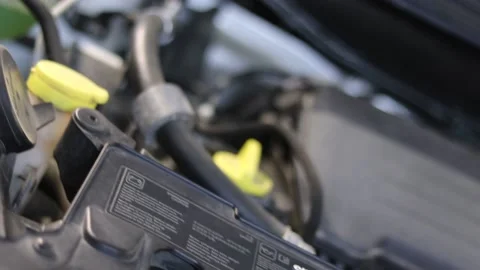 Zoom out from engine compartment slow motion car hood Stock Footage 135949834
