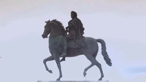 Zoom out with the equestrian statue of King Louis XIV in Place Bellecour Stock Footage 268948754