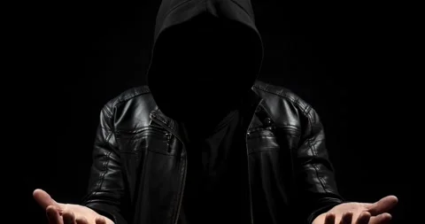 Zoom out of a faceless hooded man in the shadows ready to holding 스톡 동영상 328319782