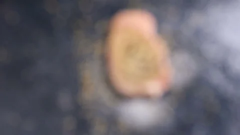 Zoom in from out of focus to close in focus on seasoned pork meat Stock Footage 83179211